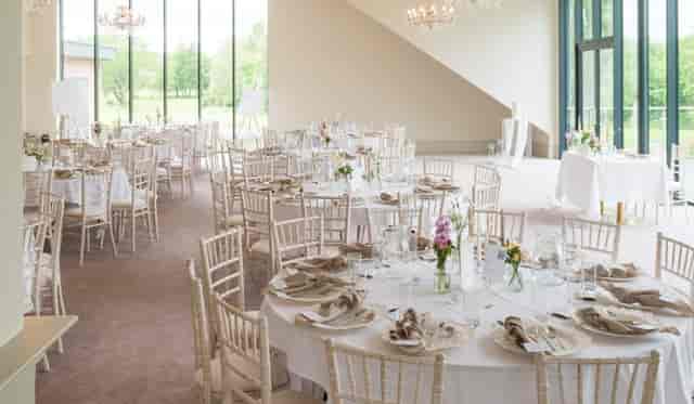 Garden Suite banquet hall with floor-to-ceiling windows for upscale social or corporate events.