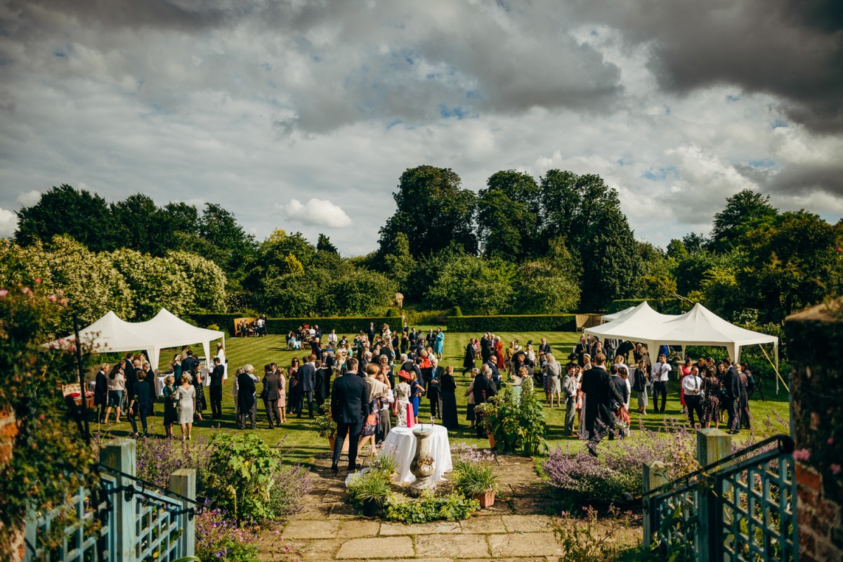 Childerley Hall garden wedding reception under cloudy skies, outdoor event planning.