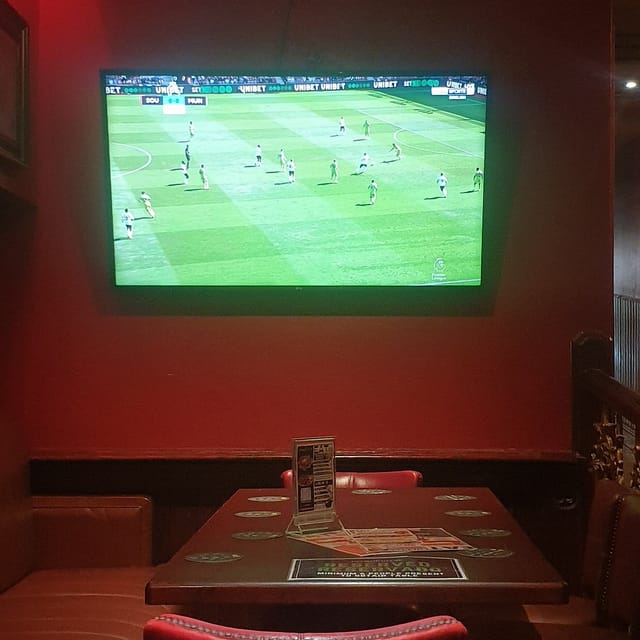 Cozy reserved booths at The George Payne for casual watch parties and networking events.