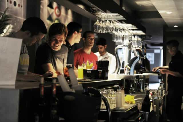 Vibrant bar at Belushi's Barcelona, perfect for social gatherings and networking events.