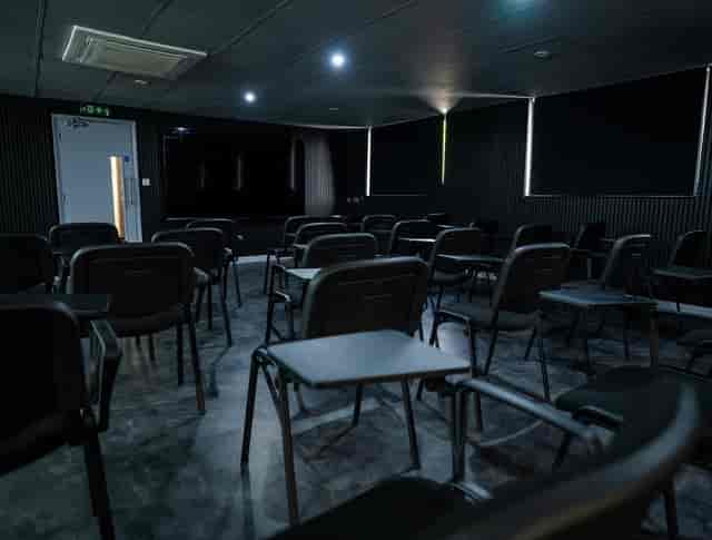 Seminar Room in SN Hub with empty chairs, ideal for corporate meetings and workshops.