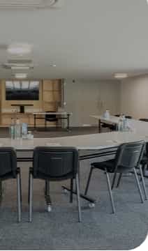 Modern meeting room at Epic Centre, Lincolnshire Showground with tables for workshops.