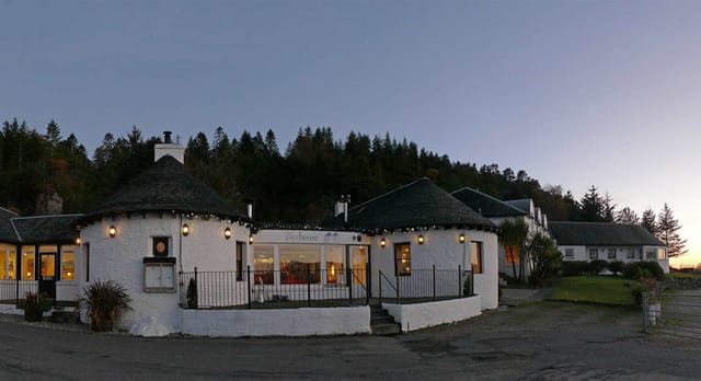 "Elegant round event space at The Pierhouse Hotel with outdoor terrace for gatherings."