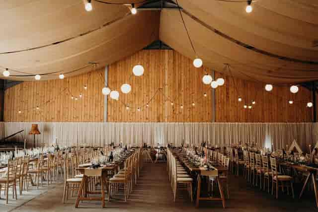 Elegant event space at Carrick Castle Estate with rustic wooden decor, perfect for weddings.