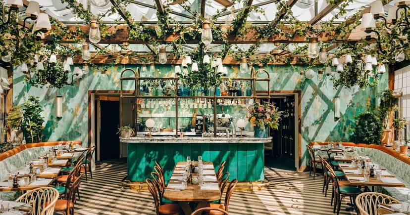 Elegant Griglia in Pink Mamma venue with greenery, perfect for events and gatherings.