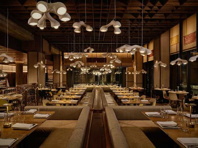Private Room in Lee: atmospheric corporate dinner venue with dramatic overhead lighting.