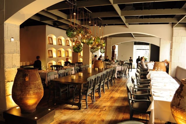 Spacious Elysium event space with communal table for corporate and private gatherings.