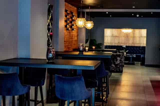 Stylish event space with ambient lighting for cocktail parties and networking events.