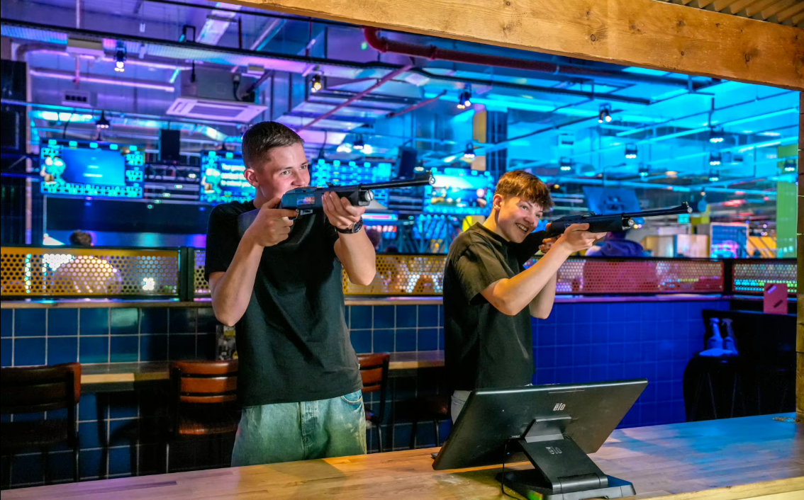 Team-building shooting simulation at The Head To Head Zone, King Pins Glasgow. 
