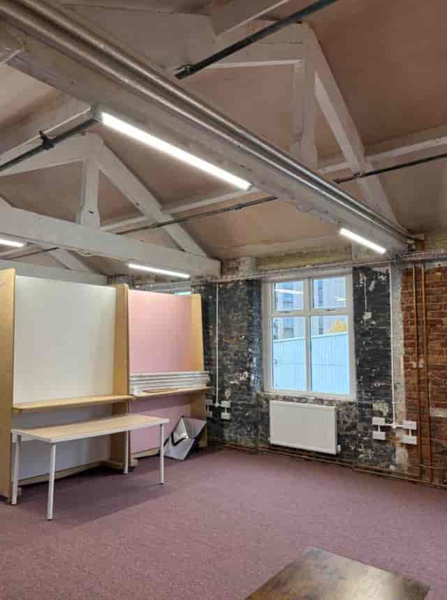 Versatile venue hire in From the Other studio with exposed brick walls for events.