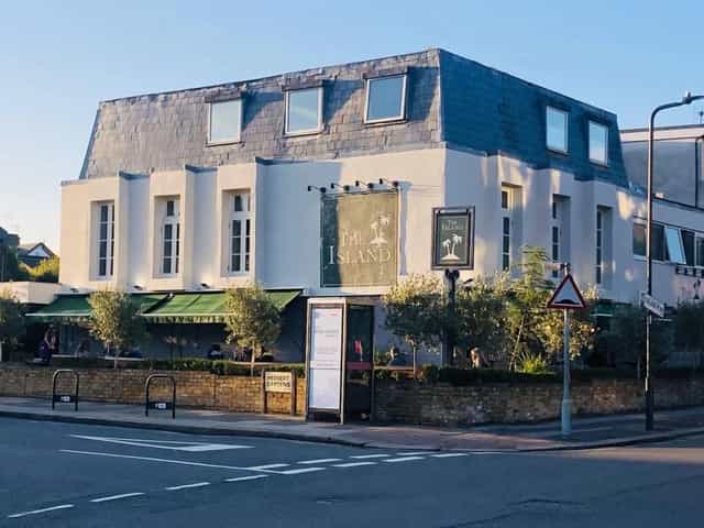 Charming venue with ample windows, ideal for corporate meetings and social events.