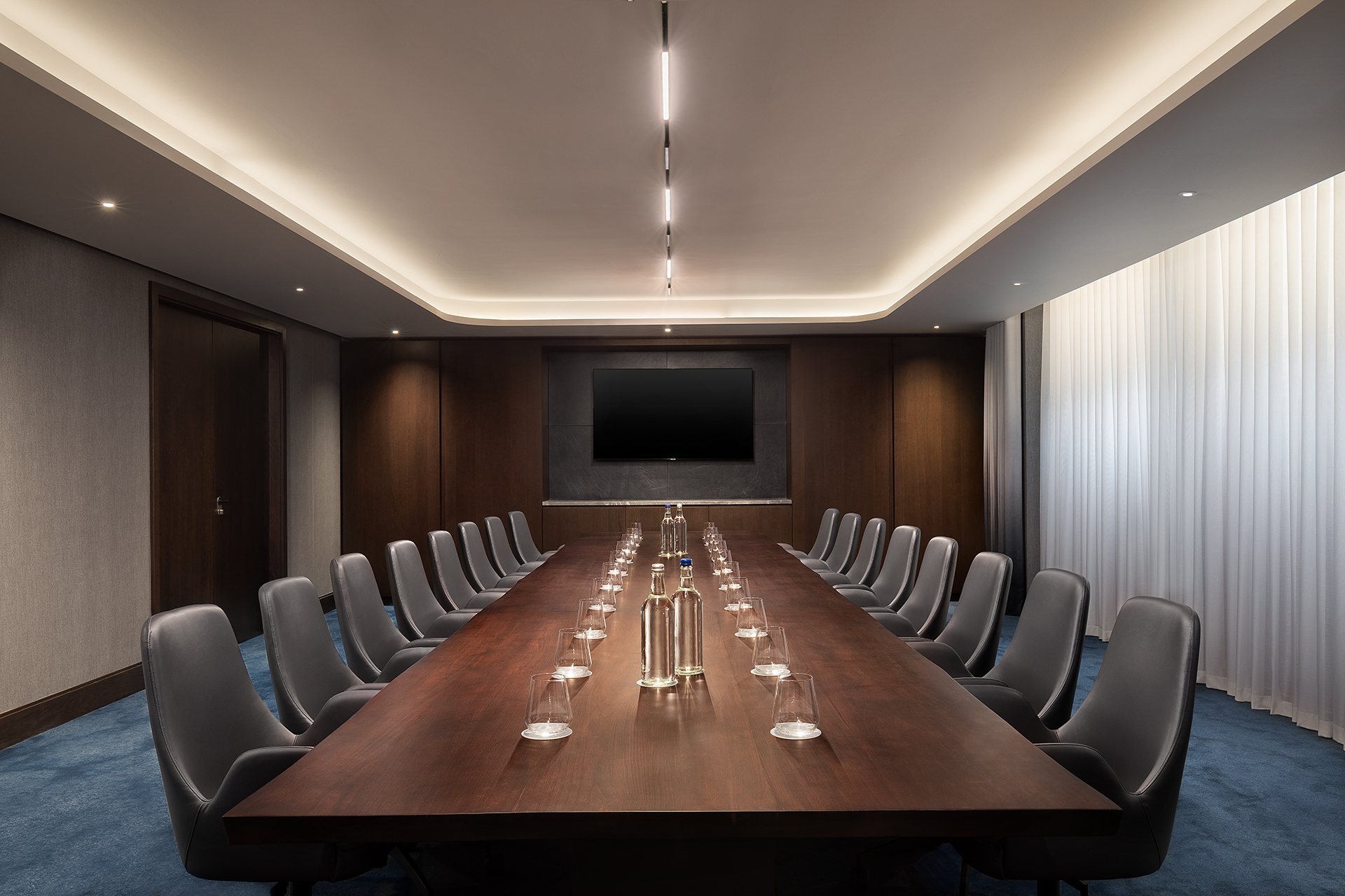 Executive boardroom at The Westin London City, featuring a long wooden table for corporate meetings.