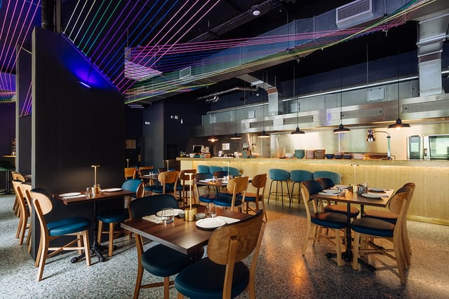 Modern restaurant interior with vibrant decor, ideal for events and gatherings.