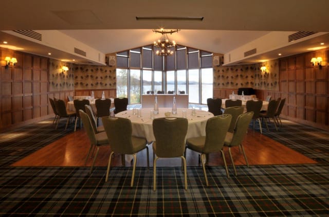 Glen Luss Suite meeting room with elegant round tables, perfect for corporate events.
