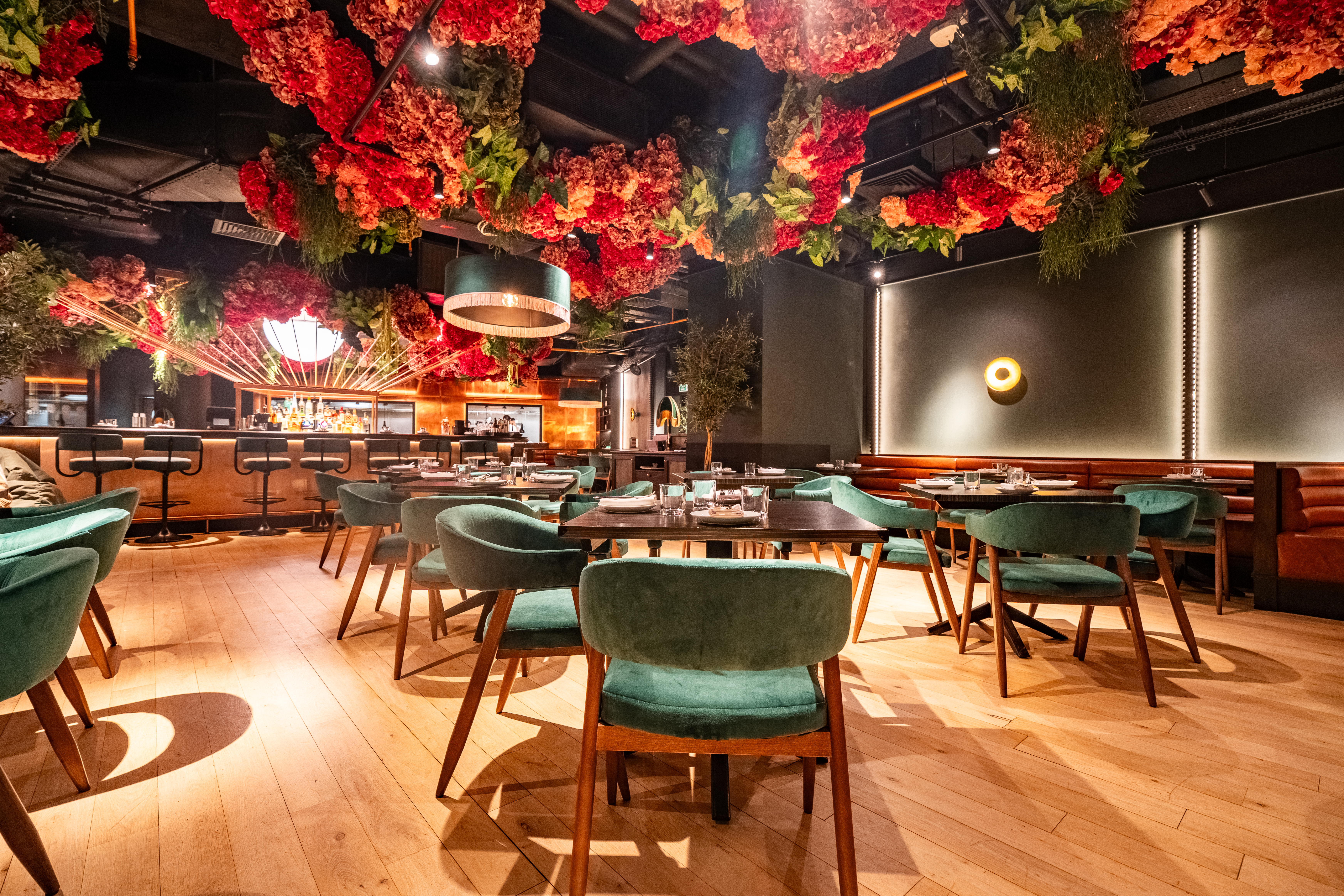 Stylish restaurant with floral ceiling, ideal for intimate dinners and networking events. - Banner
