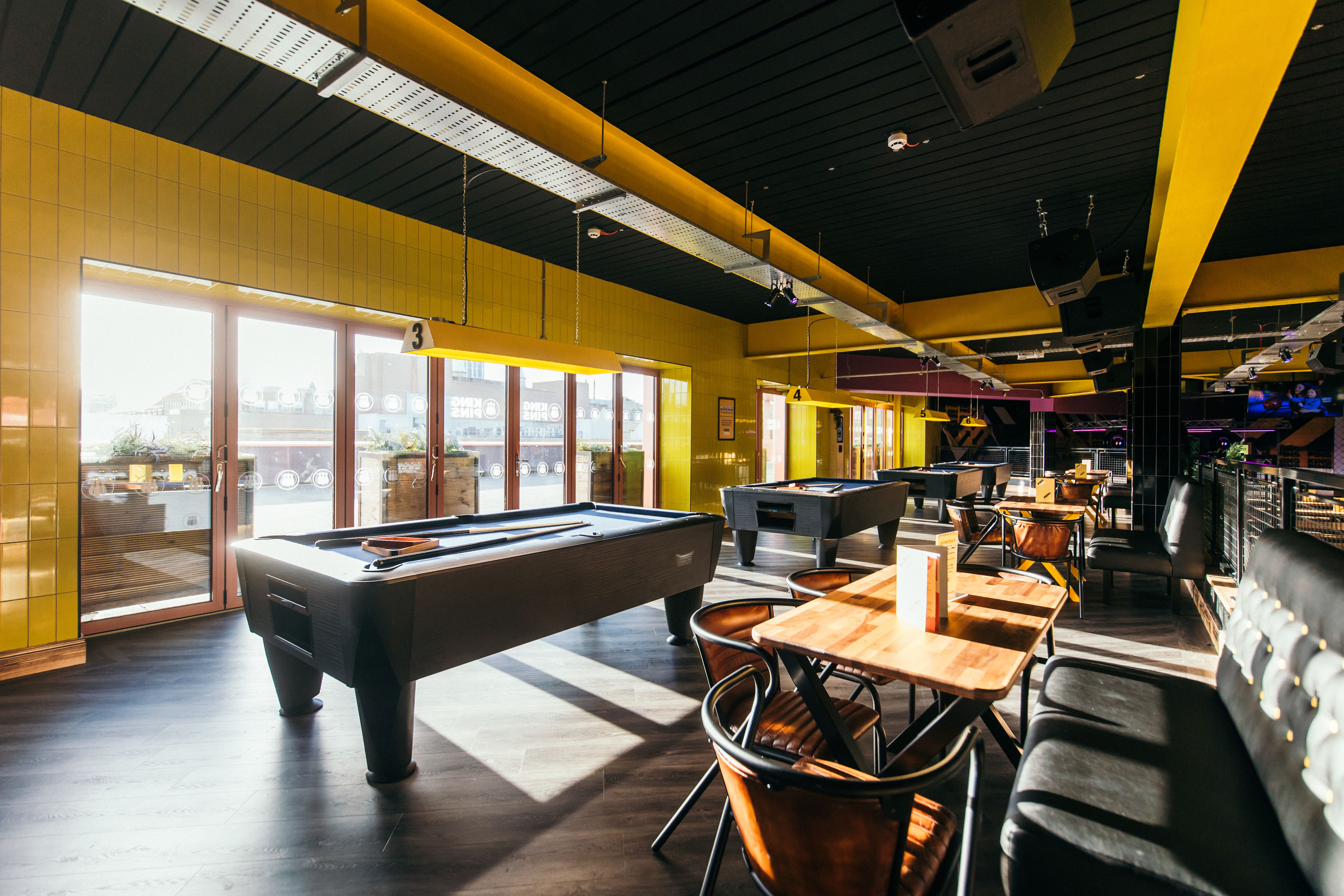 Vibrant event space with pool tables for team-building and networking at King Pins, Belfast.