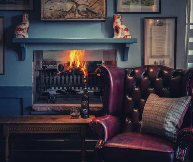 Cozy lounge at Loch Lomond Arms, featuring leather chairs for intimate meetings and gatherings.