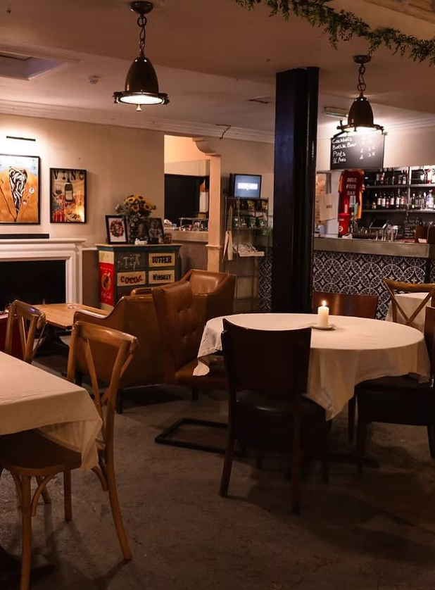 Cozy Bold Food & Bar venue with ambient lighting for intimate meetings and events. - Banner