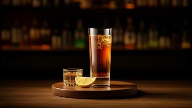 Elegant cocktail setup for networking event with tall glass and sophisticated ambiance.