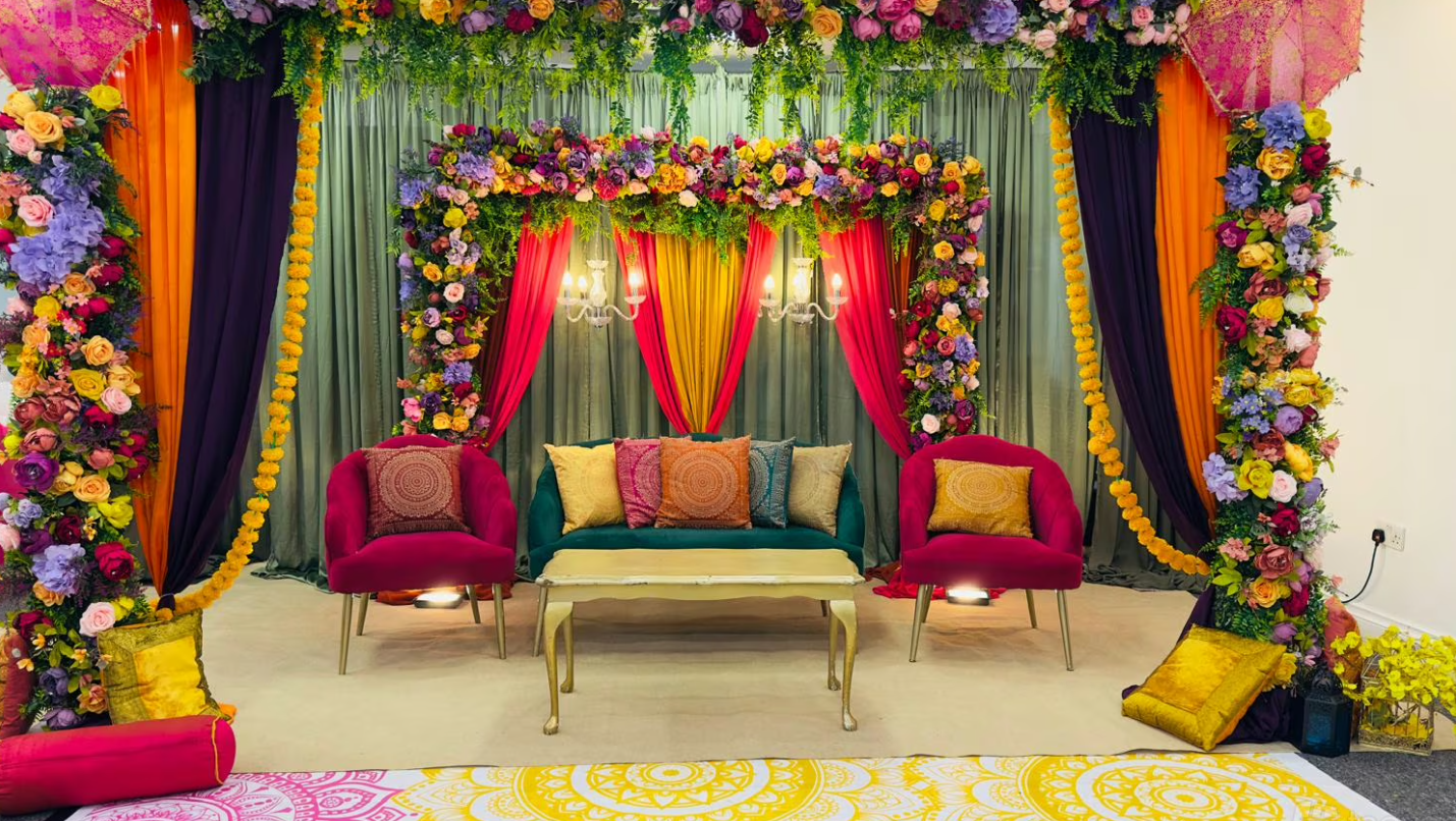 Vibrant floral-decorated wedding venue with plush seating in Hidden Space Function Hall - Banner