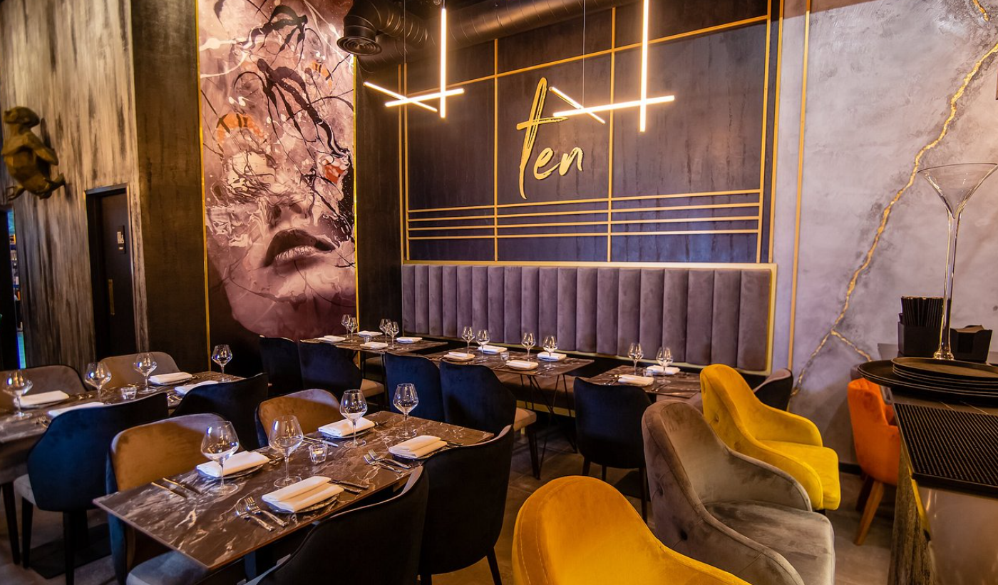 Elegant restaurant dining space with plush seating, perfect for upscale events and gatherings.