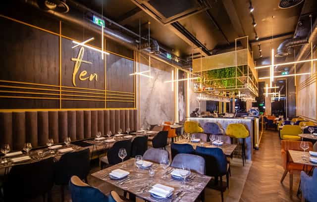Modern upscale restaurant with elegant decor, ideal for corporate events and celebrations.