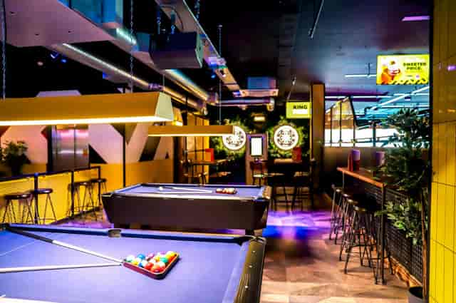 "Vibrant event space with pool tables at Head-To-Head Zone, King Pins Bristol."
