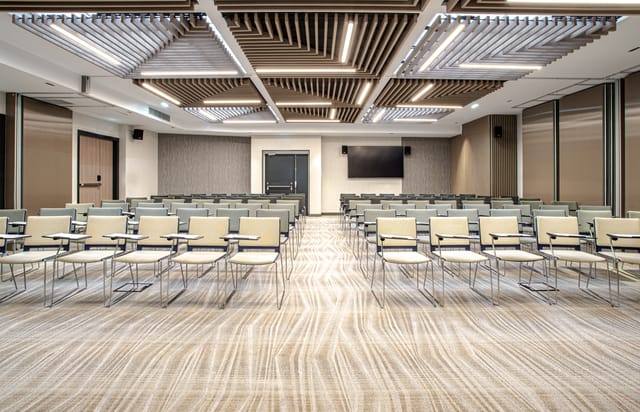 Modern conference room with flexible seating at Courtyard by Marriott Paris, ideal for workshops.