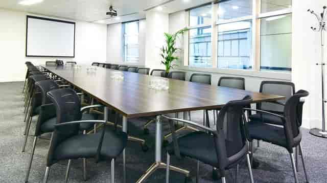 Boardroom at 5 King William Street with long table for corporate presentations and meetings.