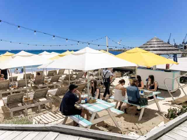 Bathers Beach House outdoor lounge with string lighting for networking events and receptions.