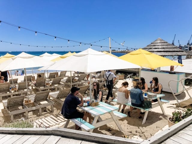 Bathers Beach House outdoor lounge with string lighting for networking events and receptions.