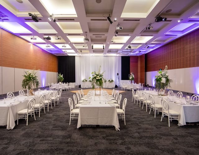 Ballroom at Esplanade Hotel Fremantle with banquet seating for corporate dinners and gala events.