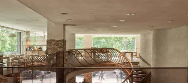 Modern event venue Mezzanine in Hide with a wooden staircase, ideal for meetings and gatherings.