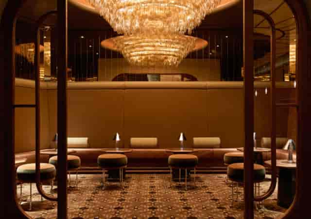 Gambit Bar at The Newman hotel: elegant meeting space with plush seating for networking events.