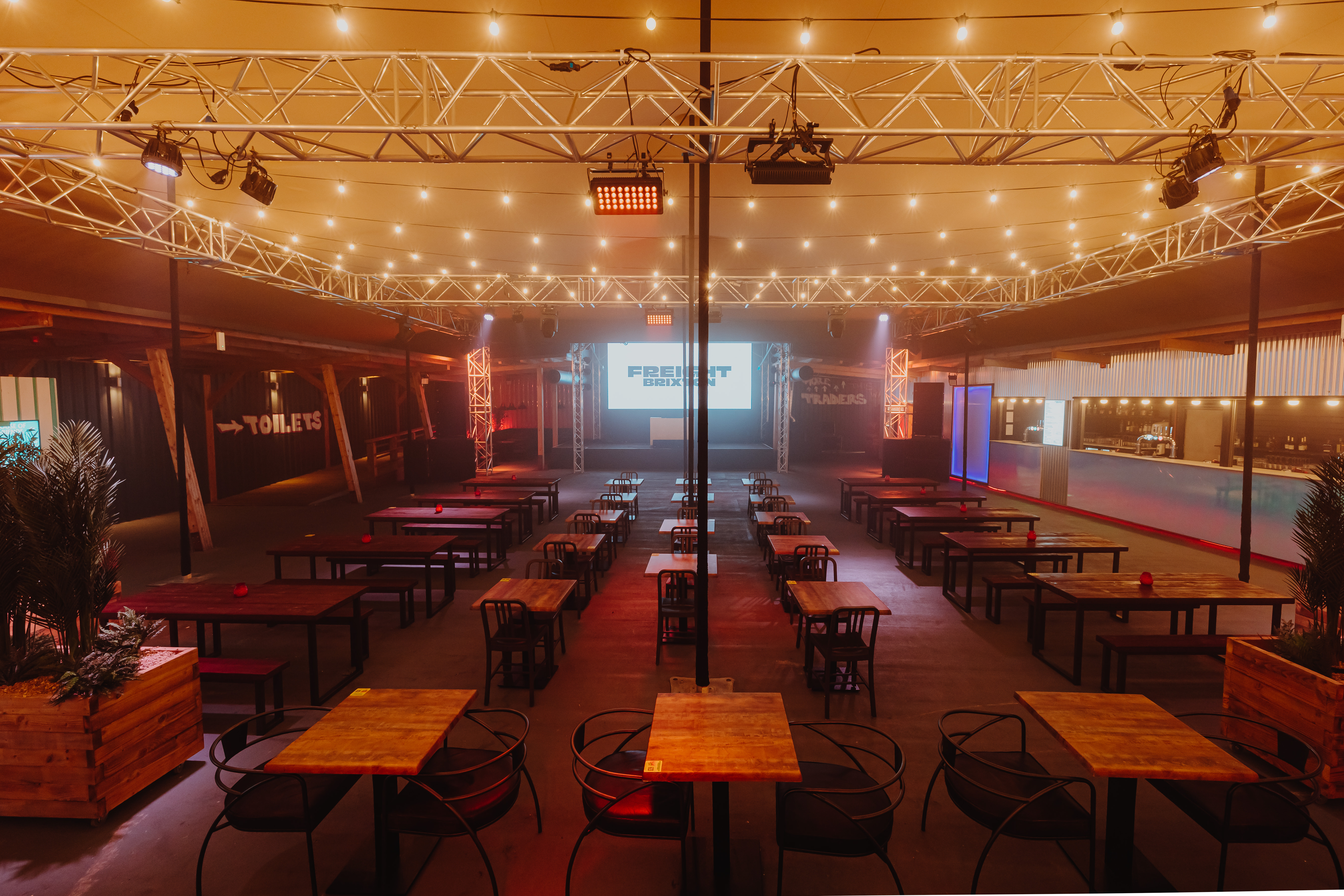 Freight Brixton venue hire: industrial cabaret space with overhead lighting truss for events.