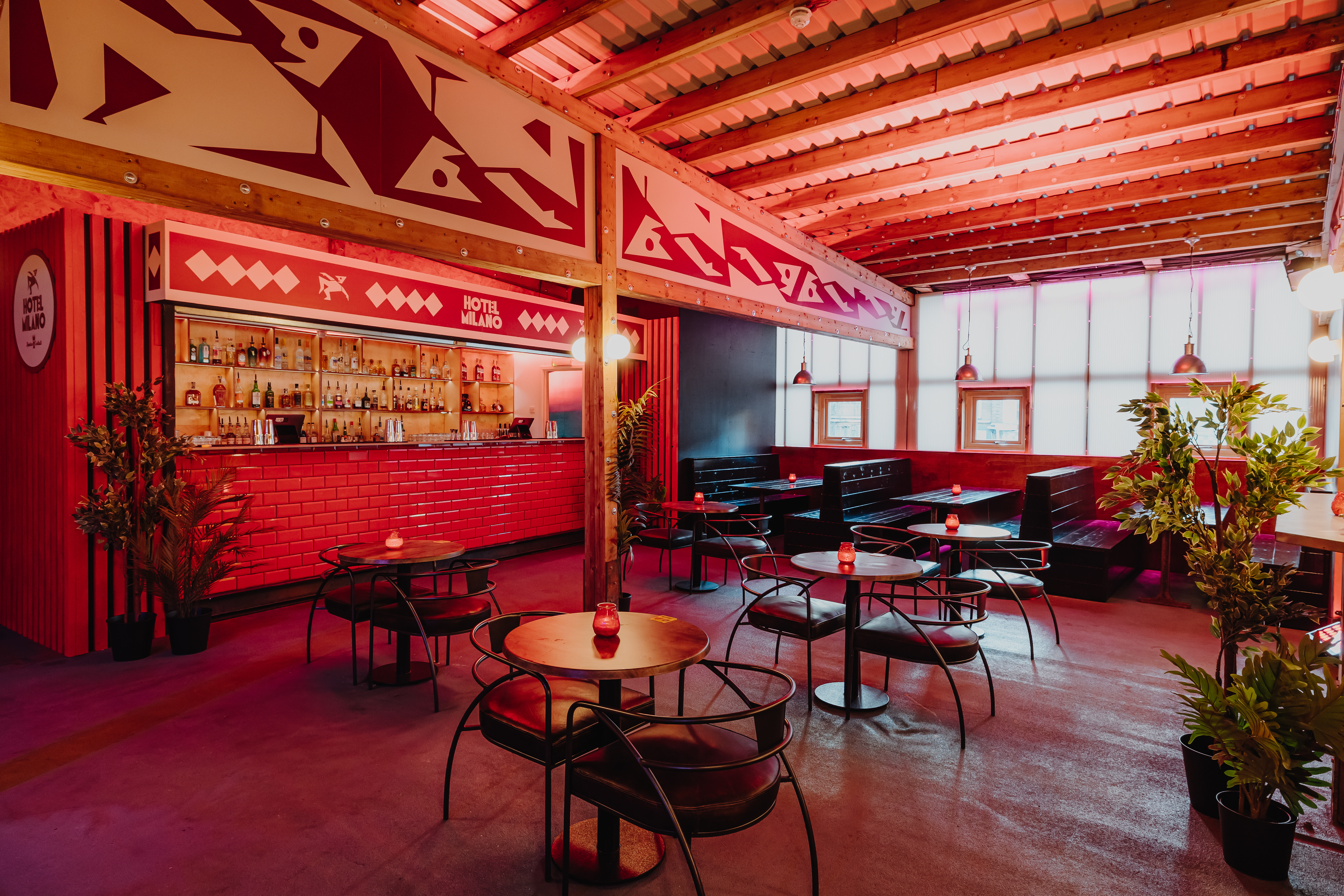 Hotel Milano Bar in Brixton: Red aesthetic venue for cocktail receptions and networking events.