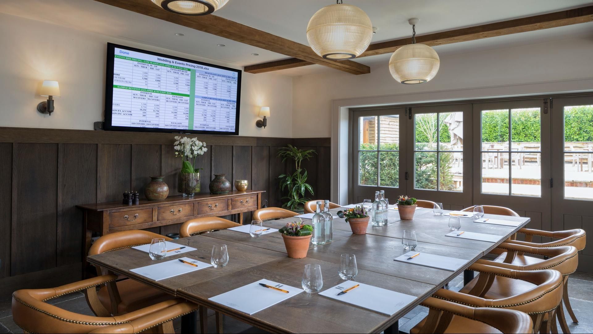 Private Meeting Room 2 at Hurley House Hotel with wooden table, perfect for corporate events. - Banner