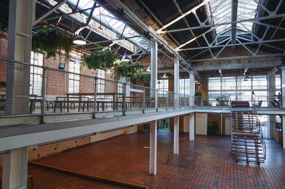 Industrial-chic event space with skylights for conferences and workshops.