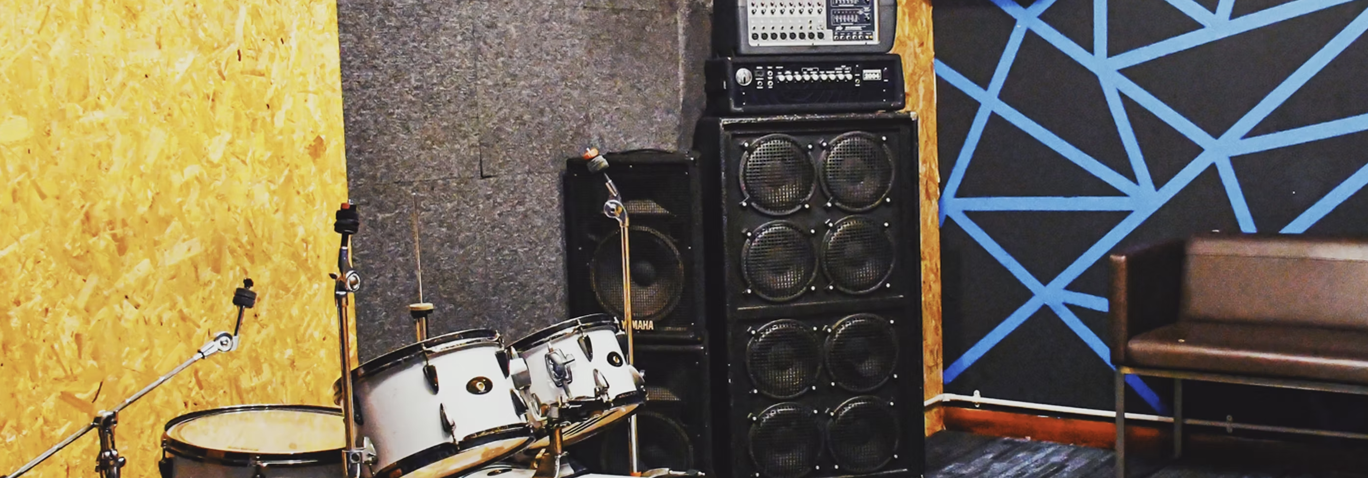 Drum kit in rehearsal studio for live music events and band practices.