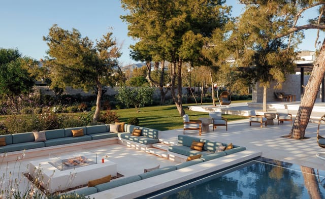 Outdoor ballroom at One&Only Aesthesis, featuring lush greenery for elegant events.