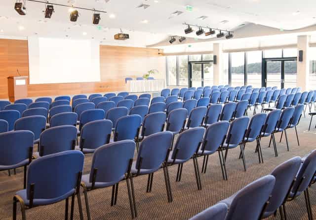 Event space in Hotel Excelsior Croatia with blue chairs for conferences and seminars.