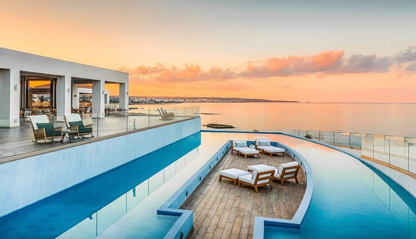 Waterfront conference room with infinity pool, perfect for upscale events and meetings.