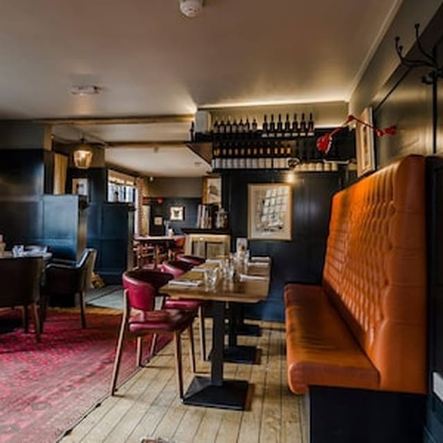 Private dining area at The Lighthouse with banquette seating for intimate events and networking.