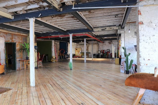 Warehouse One industrial venue with exposed beams for brand activations and creative workshops.