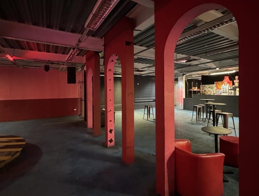 Urban event space with archways, ideal for workshops and showcases.
