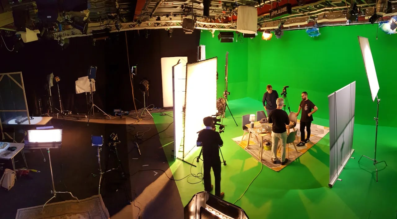 Green screen studio with professional lighting for video productions and virtual events.