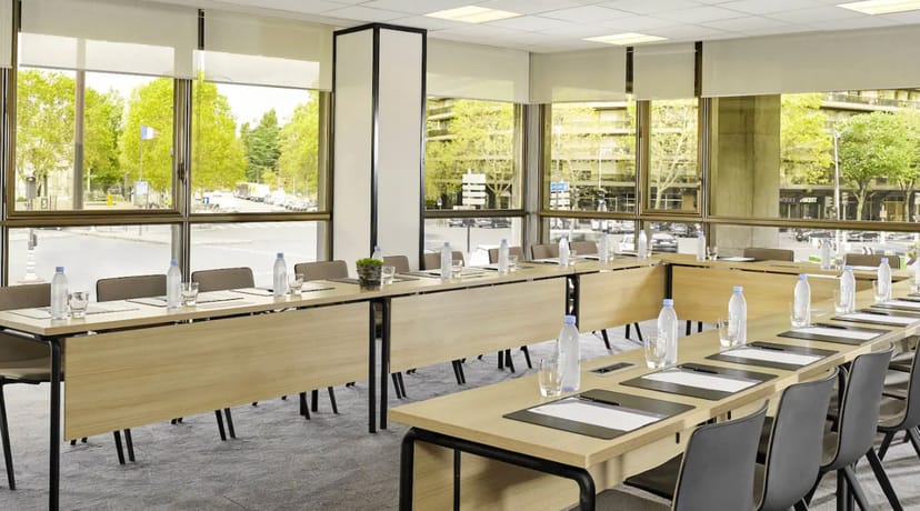 Modern conference room at Hyatt Regency Paris Etoile, bright and inviting for meetings.