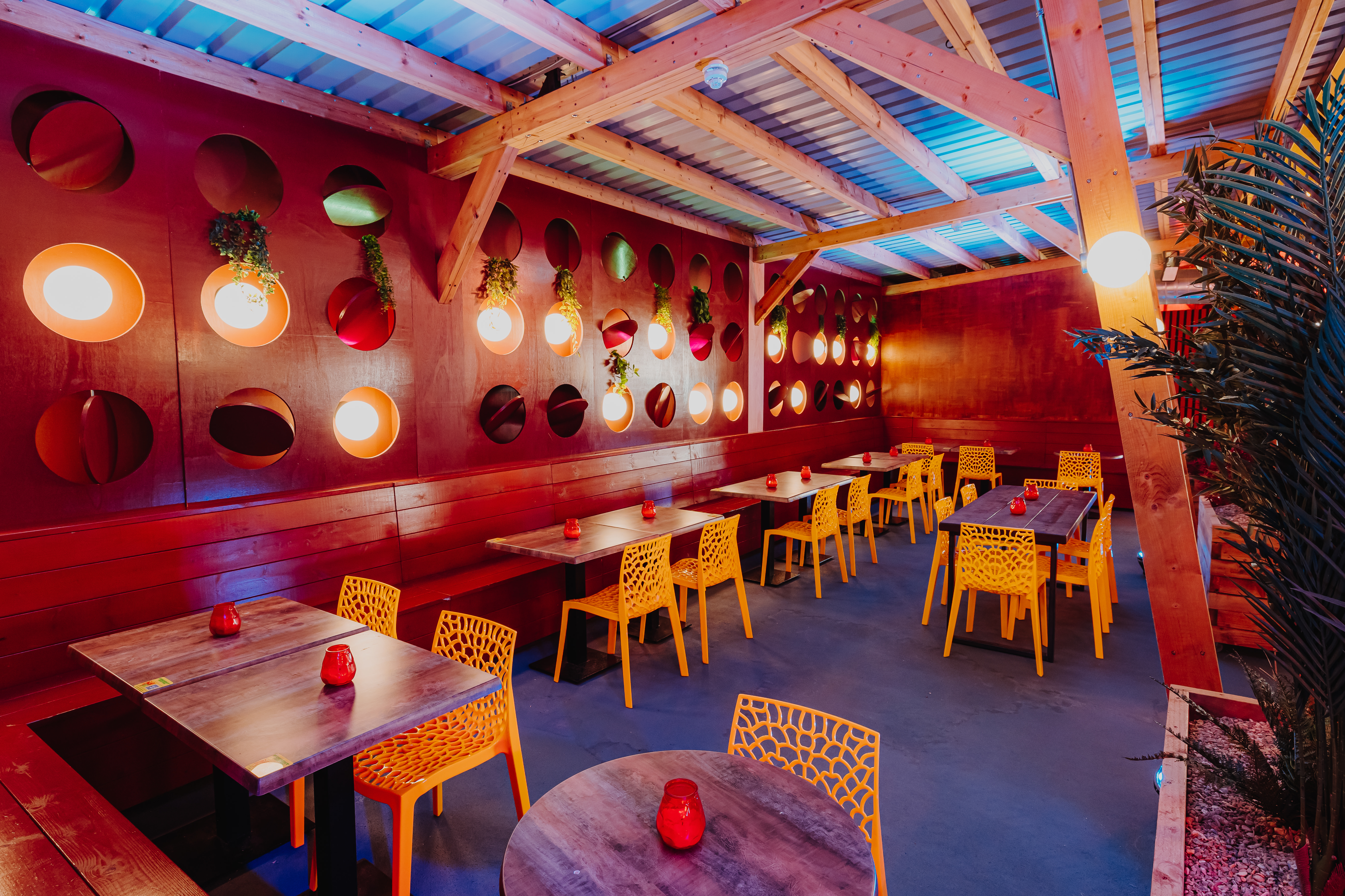 Yellow Zone event space with circular lighting, ideal for networking and social mixers.