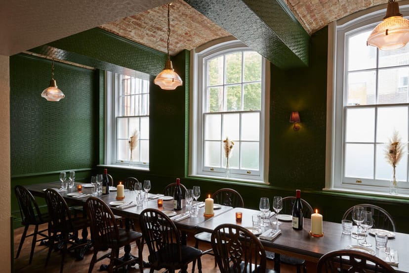 Elegant dining space in The Green Room, ideal for intimate gatherings and networking events.