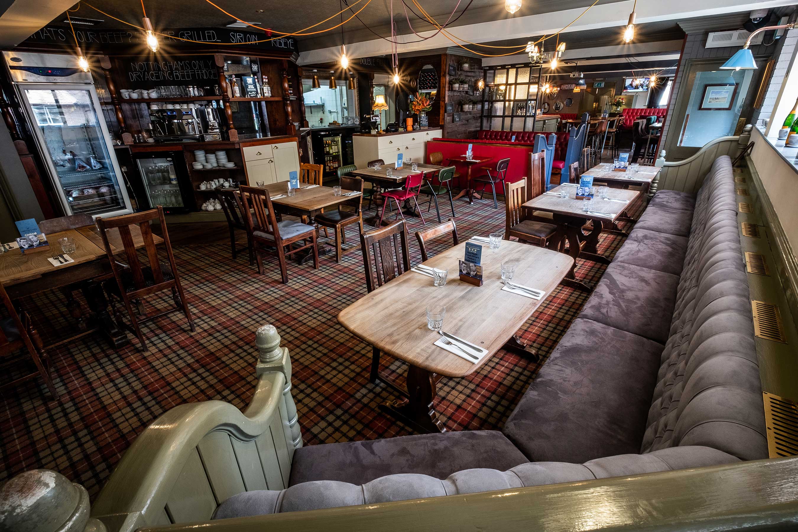 Bar & Restaurant booth seating, ideal for events and gatherings in warm, inviting space.